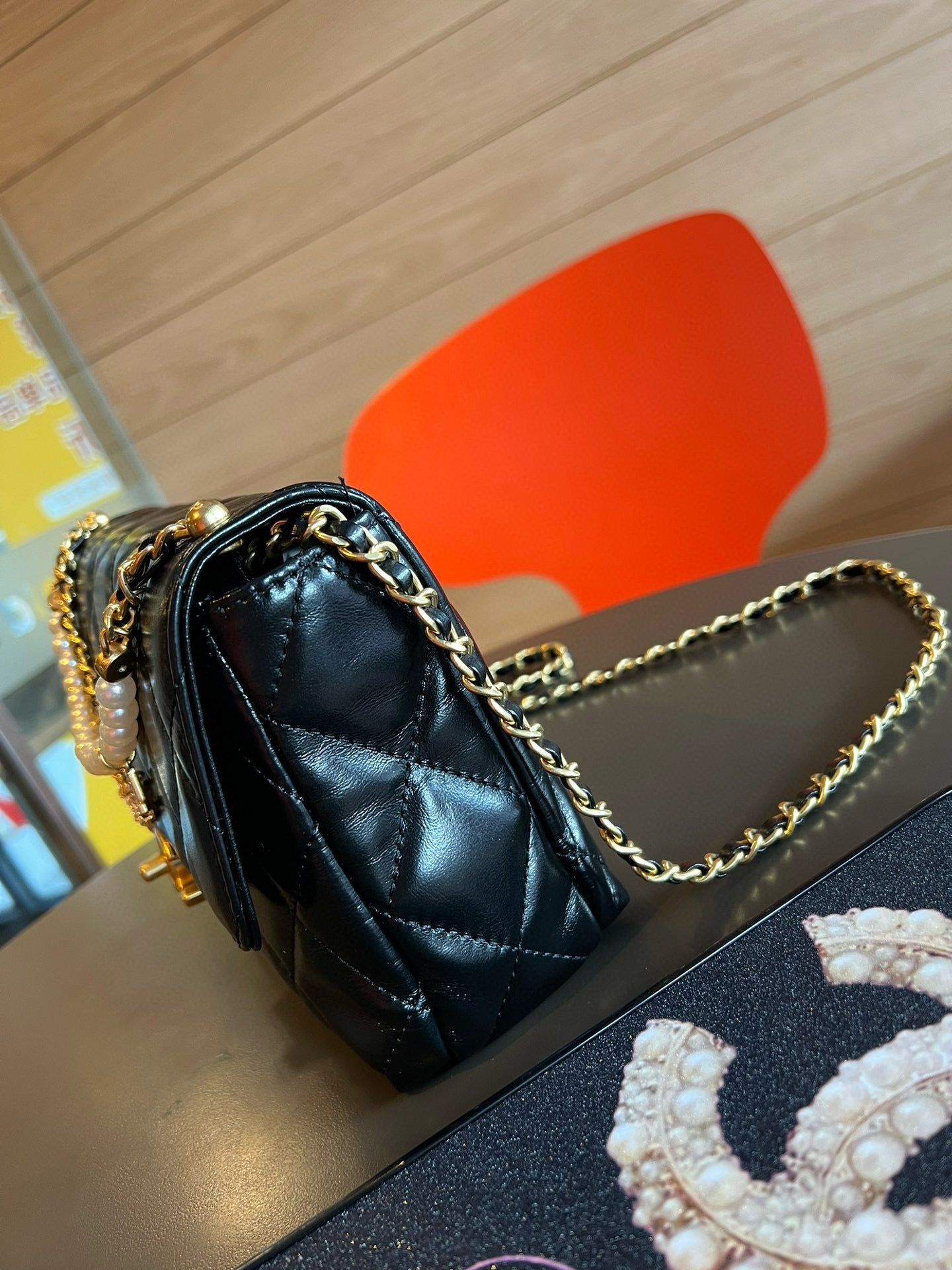 CE-24A pearl necklace flap bag