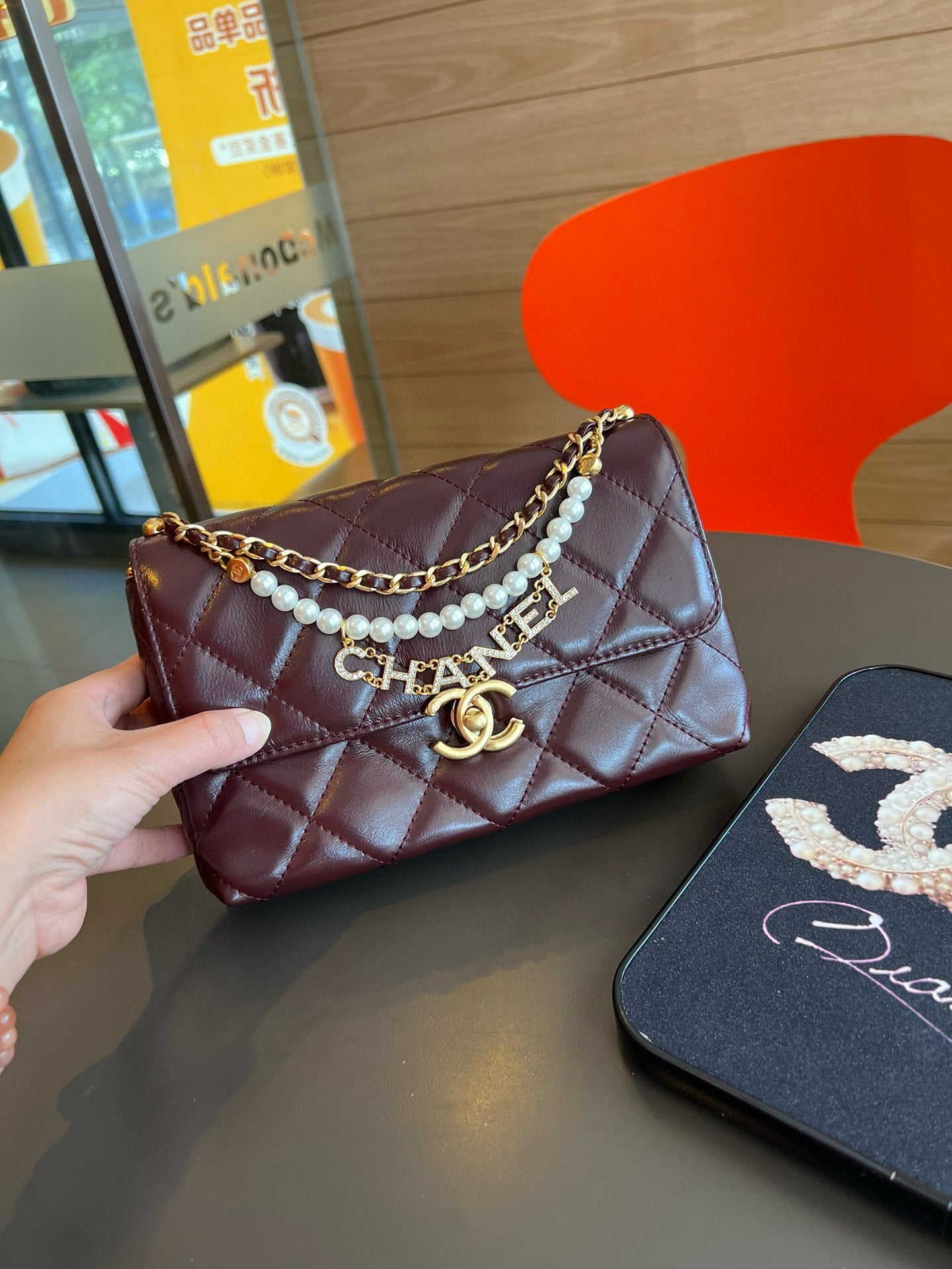 CE-24A pearl necklace flap bag