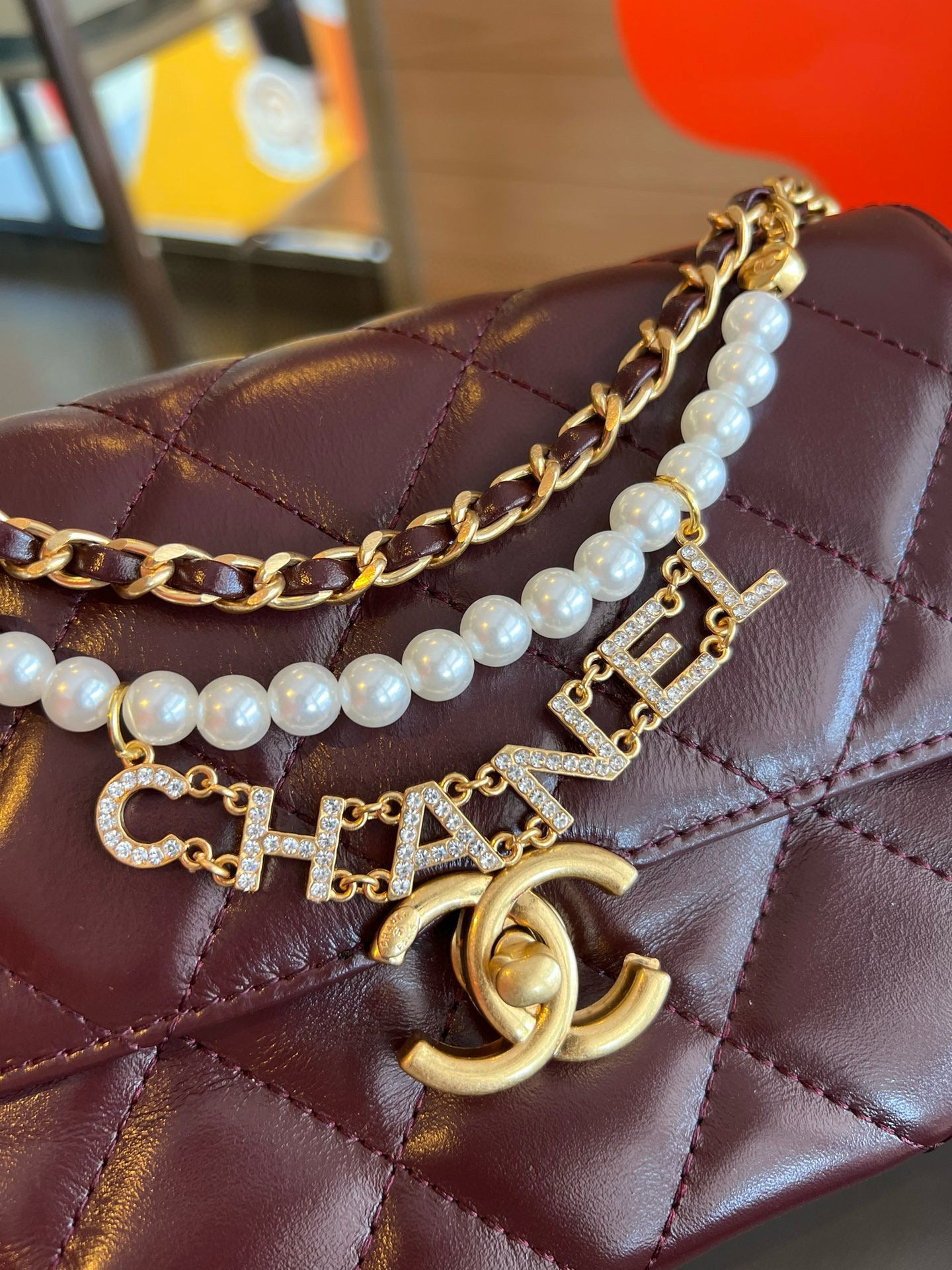 CE-24A pearl necklace flap bag