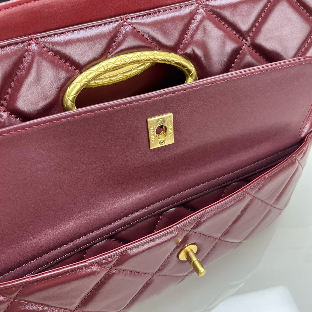 CE-24b’s new black gold evening bag