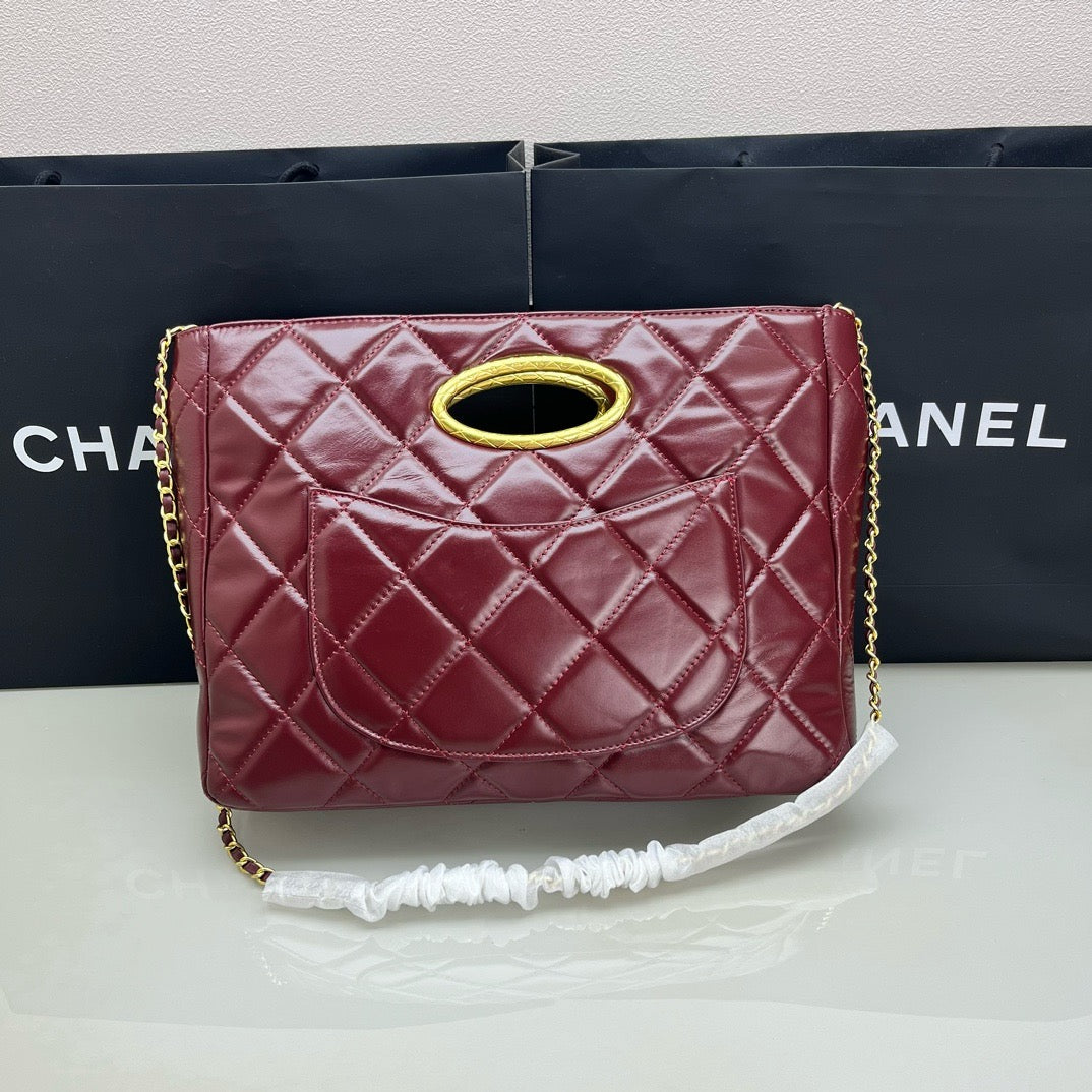 CE-24b’s new black gold evening bag